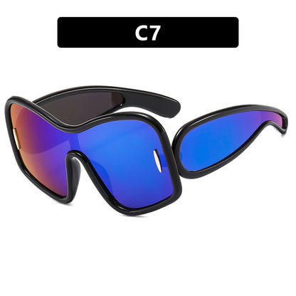 Schicke Sonnenbrille mit unregelmäßigem großem Rahmen